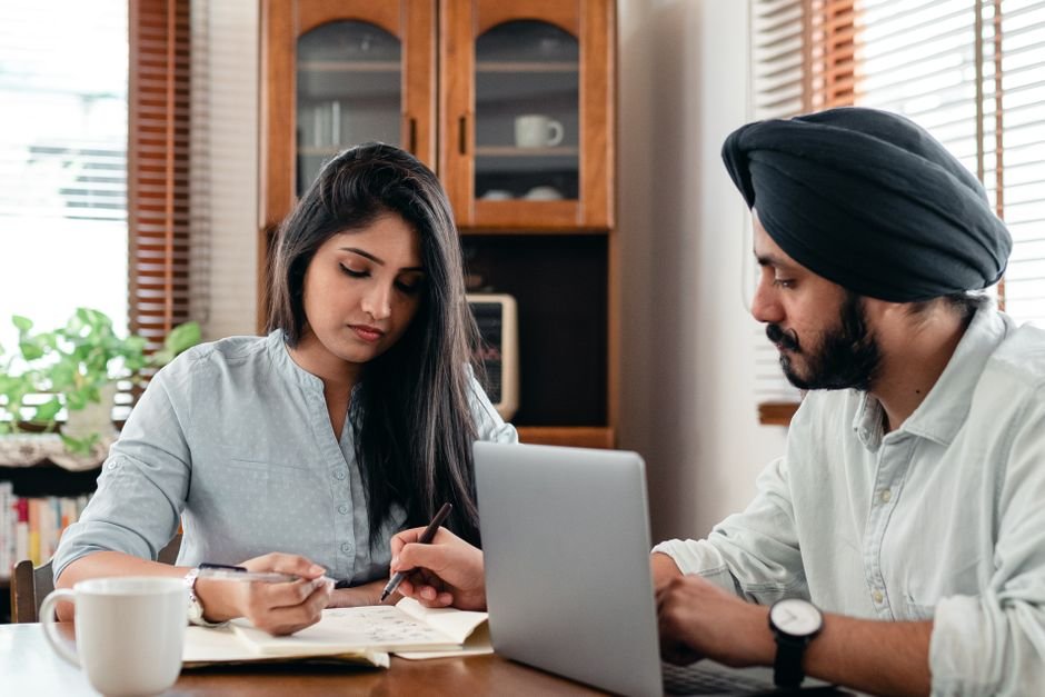 Young Indian professionals working on laptops, preparing for the highest paying jobs in India